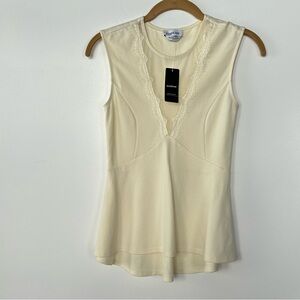 Bebe sheer lace peplum top off white